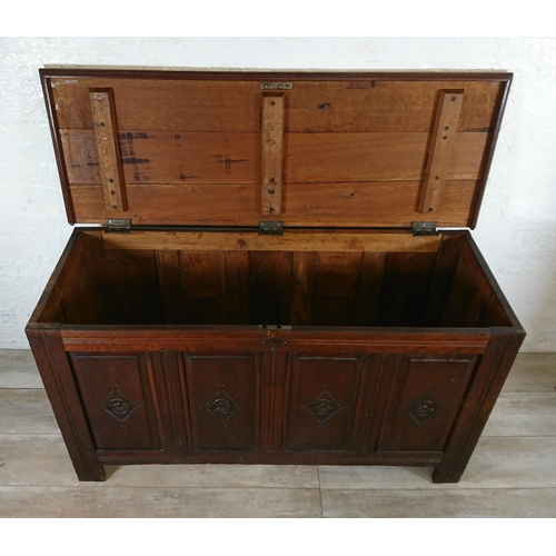 178 - An 18th century and later carved oak four panel coffer - approx. 74cm high x 131cm wide x 49cm deep