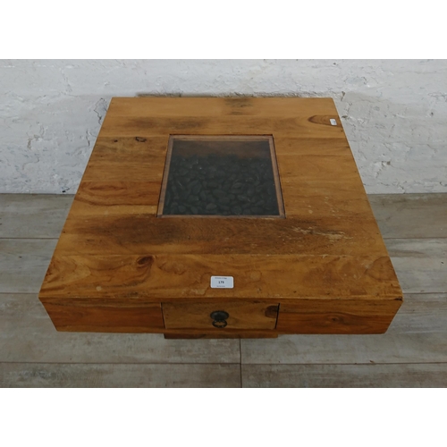 179 - An Indian sheesham wood pebble coffee table - approx. 46cm high x 60cm wide x 60cm deep