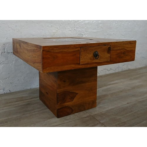 179 - An Indian sheesham wood pebble coffee table - approx. 46cm high x 60cm wide x 60cm deep