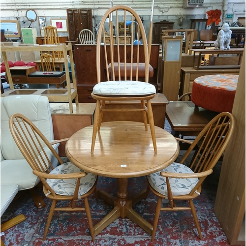 182 - Four pieces of furniture, three Ercol Windsor blonde elm dining chairs and one beech circular pedest... 