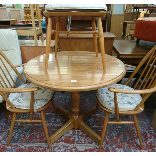 182 - Four pieces of furniture, three Ercol Windsor blonde elm dining chairs and one beech circular pedest... 