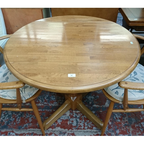 182 - Four pieces of furniture, three Ercol Windsor blonde elm dining chairs and one beech circular pedest... 