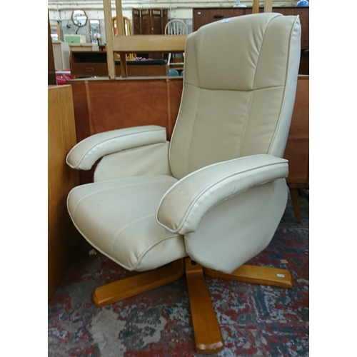 183 - A Stressless style cream leather and bentwood swivel reclining armchair