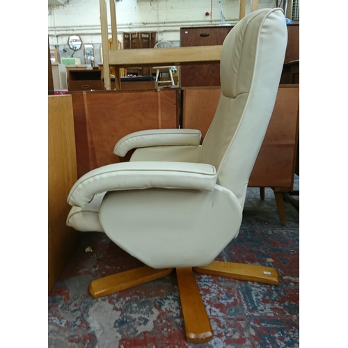 183 - A Stressless style cream leather and bentwood swivel reclining armchair