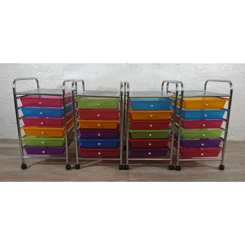 184 - Four chrome plated and multi coloured plastic six drawer storage trolleys - approx. 61cm high x 32cm... 