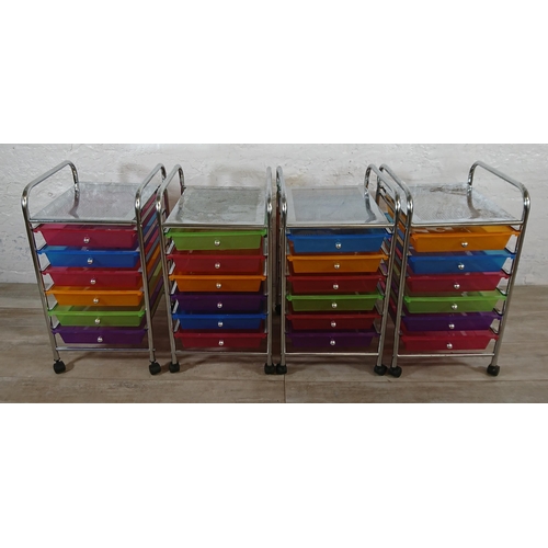 184 - Four chrome plated and multi coloured plastic six drawer storage trolleys - approx. 61cm high x 32cm... 