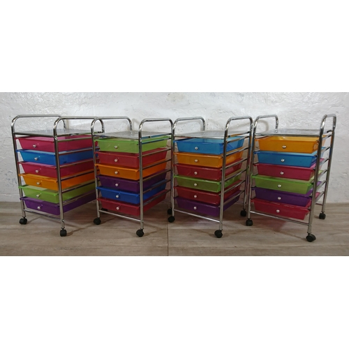 184 - Four chrome plated and multi coloured plastic six drawer storage trolleys - approx. 61cm high x 32cm... 