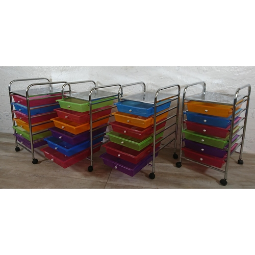 184 - Four chrome plated and multi coloured plastic six drawer storage trolleys - approx. 61cm high x 32cm... 