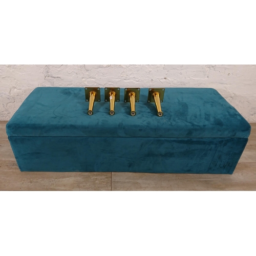 186 - A modern teal fabric upholstered blanket box on gilt metal supports - approx. 29cm high x 109cm wide... 