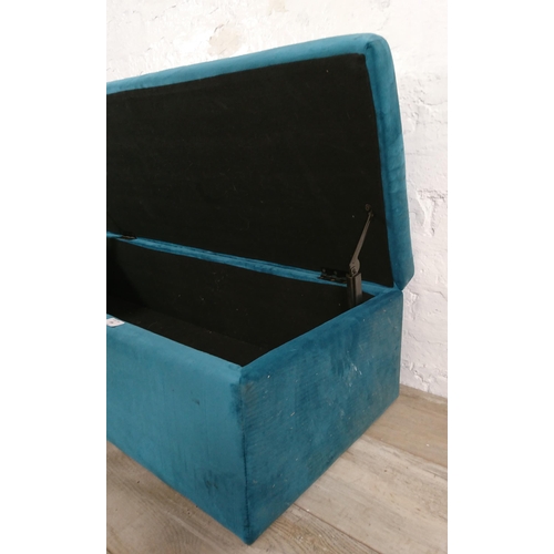 186 - A modern teal fabric upholstered blanket box on gilt metal supports - approx. 29cm high x 109cm wide... 