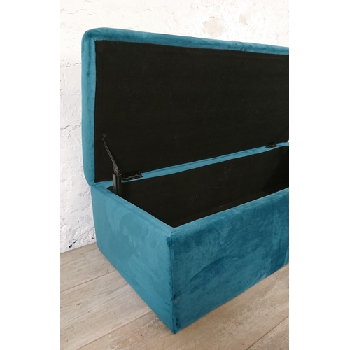 186 - A modern teal fabric upholstered blanket box on gilt metal supports - approx. 29cm high x 109cm wide... 