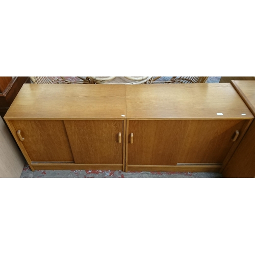 187 - Two mid/late 20th century oak two door office cabinets - approx. 72cm high x 91cm wide x 46cm deep