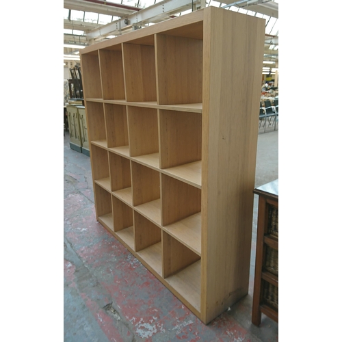 188 - A modern oak effect sixteen section cube shelving unit - approx. 157cm high x 155cm wide x 36cm deep