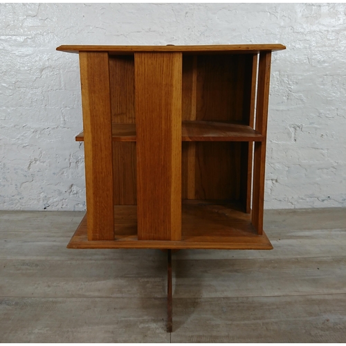 190 - A mid 20th century oak revolving bookcase - approx. 75cm high x 59cm wide x 59cm deep