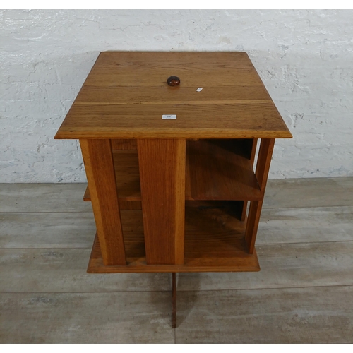 190 - A mid 20th century oak revolving bookcase - approx. 75cm high x 59cm wide x 59cm deep