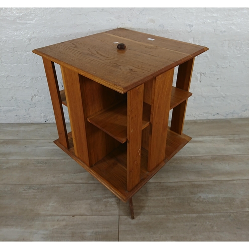 190 - A mid 20th century oak revolving bookcase - approx. 75cm high x 59cm wide x 59cm deep