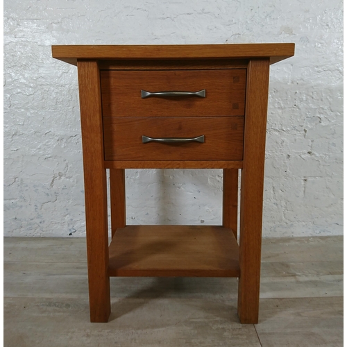 191 - A modern oak two drawer side table - approx. 65cm high x 50cm wide x 35cm deep