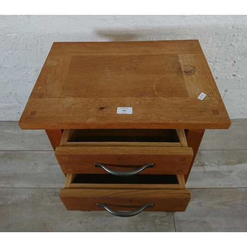 191 - A modern oak two drawer side table - approx. 65cm high x 50cm wide x 35cm deep