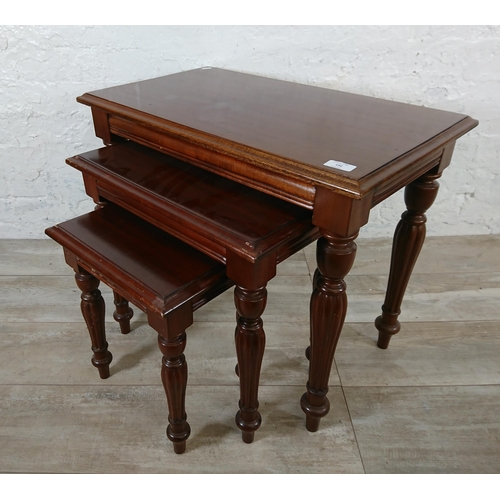 192 - A 19th century style mahogany nest of tables - approx. 55cm high x 67cm wide x 39cm deep