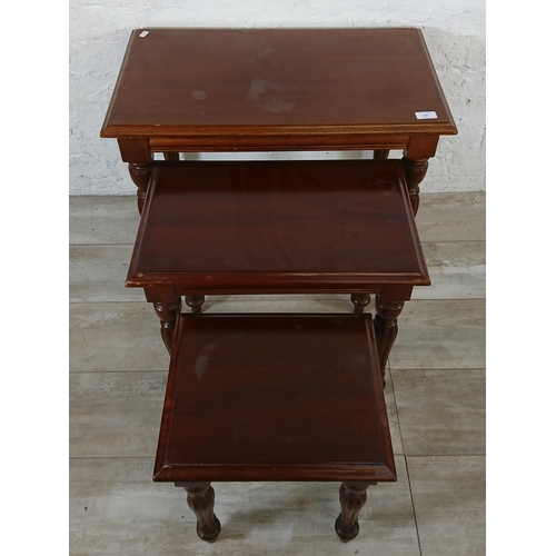 192 - A 19th century style mahogany nest of tables - approx. 55cm high x 67cm wide x 39cm deep