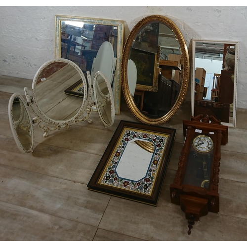 194 - Six items, one Highlands oak cased chiming wall clock with pendulum and key and five various mirrors