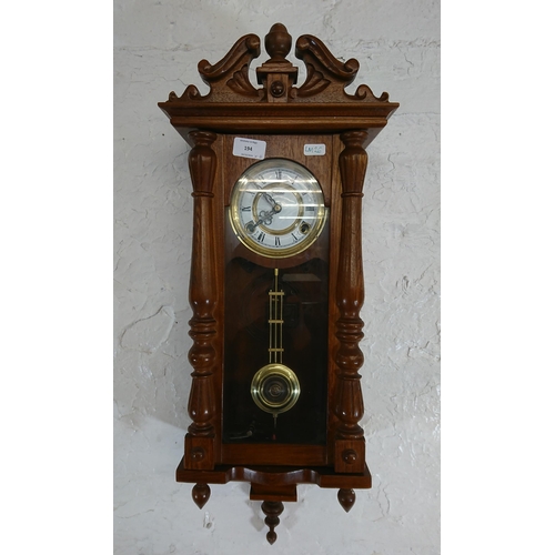 194 - Six items, one Highlands oak cased chiming wall clock with pendulum and key and five various mirrors