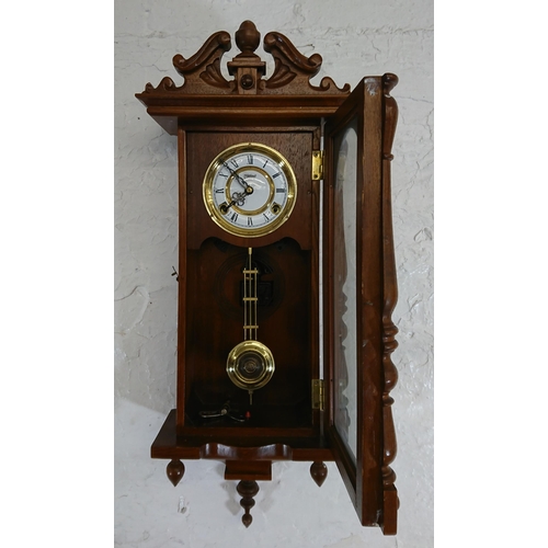 194 - Six items, one Highlands oak cased chiming wall clock with pendulum and key and five various mirrors