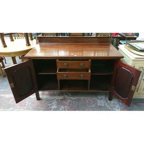 197 - An Edwardian carved mahogany sideboard - approx. 97cm high x 152cm wide x 65cm deep