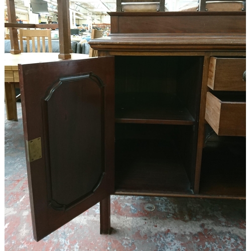 197 - An Edwardian carved mahogany sideboard - approx. 97cm high x 152cm wide x 65cm deep