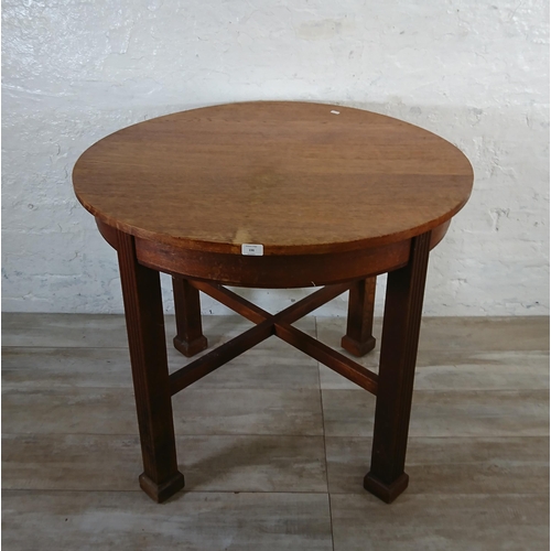 198 - A Waring & Gillow Ltd oak circular dining table - approx. 77cm high x 91cm diameter