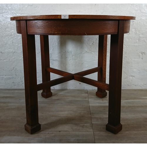 198 - A Waring & Gillow Ltd oak circular dining table - approx. 77cm high x 91cm diameter