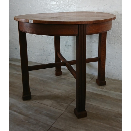 198 - A Waring & Gillow Ltd oak circular dining table - approx. 77cm high x 91cm diameter