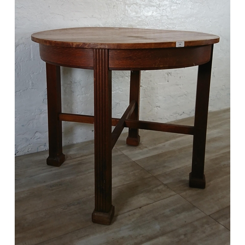 198 - A Waring & Gillow Ltd oak circular dining table - approx. 77cm high x 91cm diameter