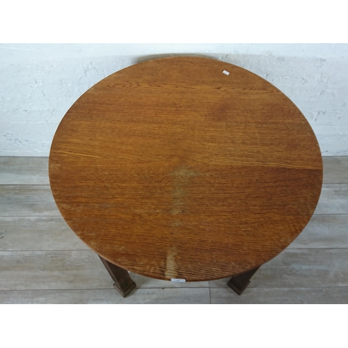 198 - A Waring & Gillow Ltd oak circular dining table - approx. 77cm high x 91cm diameter