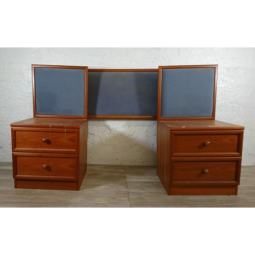 205 - A pair of G Plan teak and blue fabric two drawer bedside cabinets with matching headboard