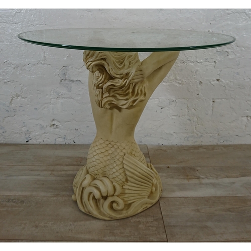 207 - A resin mermaid side table with glass top - approx. 57cm high x 61cm diameter