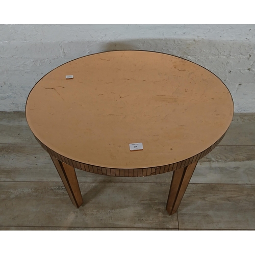 208 - A mid 20th century Art Deco style copper tinted mirrored glass side table - approx. 56cm high x 66cm... 