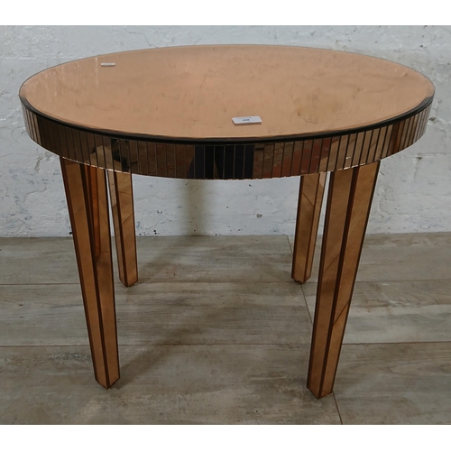 208 - A mid 20th century Art Deco style copper tinted mirrored glass side table - approx. 56cm high x 66cm... 