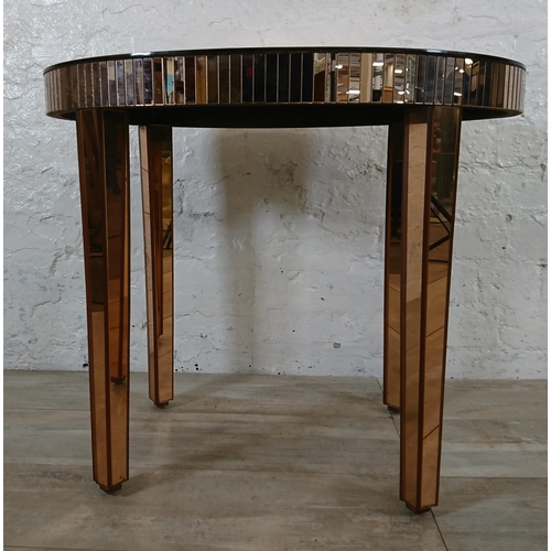 208 - A mid 20th century Art Deco style copper tinted mirrored glass side table - approx. 56cm high x 66cm... 