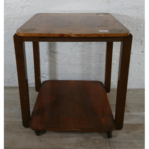 210 - An Art Deco walnut and bentwood two tier side table on castors - approx. 65cm high x 50cm wide x 50c... 