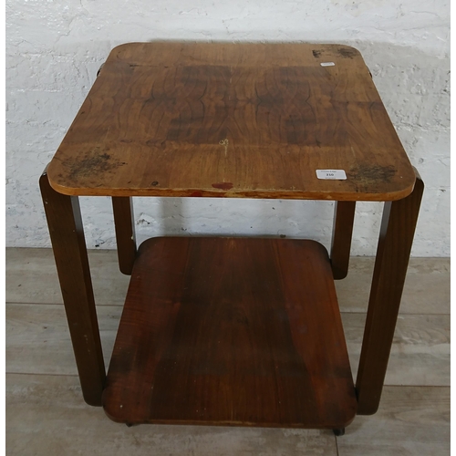 210 - An Art Deco walnut and bentwood two tier side table on castors - approx. 65cm high x 50cm wide x 50c... 