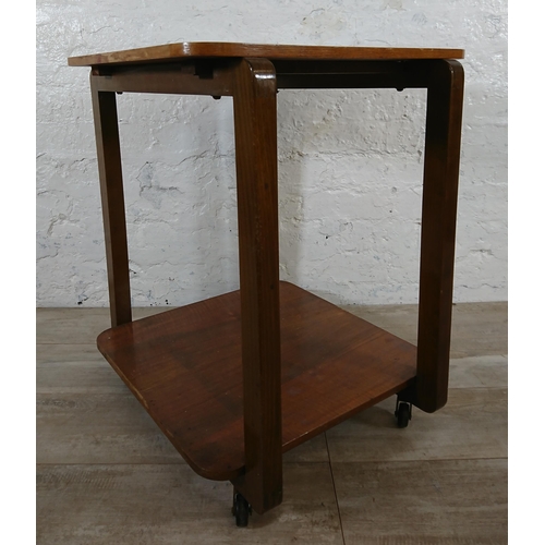 210 - An Art Deco walnut and bentwood two tier side table on castors - approx. 65cm high x 50cm wide x 50c... 