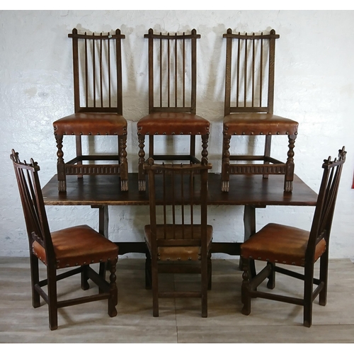 215A - A Nigel Griffiths carved oak dining table and six leather chairs - table approx. 72cm high x 74cm wi... 