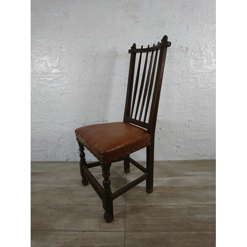 215A - A Nigel Griffiths carved oak dining table and six leather chairs - table approx. 72cm high x 74cm wi... 