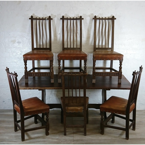 215A - A Nigel Griffiths carved oak dining table and six leather chairs - table approx. 72cm high x 74cm wi... 