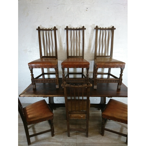 215A - A Nigel Griffiths carved oak dining table and six leather chairs - table approx. 72cm high x 74cm wi... 