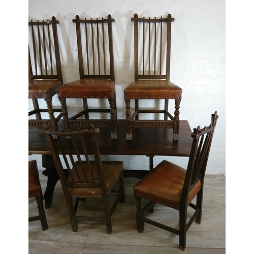 215A - A Nigel Griffiths carved oak dining table and six leather chairs - table approx. 72cm high x 74cm wi... 