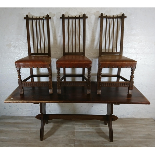 215A - A Nigel Griffiths carved oak dining table and six leather chairs - table approx. 72cm high x 74cm wi... 