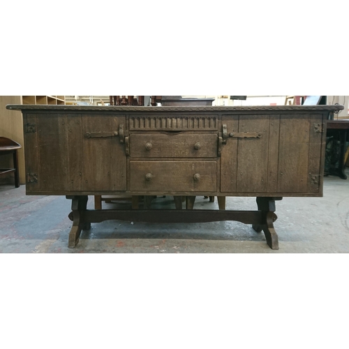 215B - A Nigel Griffiths carved oak sideboard - approx. 76cm high x 168cm wide x 46cm deep