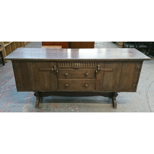 215B - A Nigel Griffiths carved oak sideboard - approx. 76cm high x 168cm wide x 46cm deep